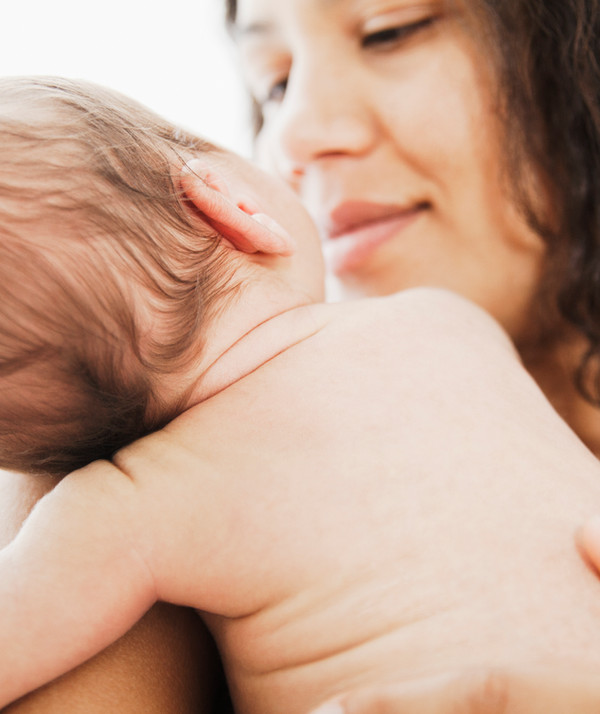 New mother lovingly gazing at her baby